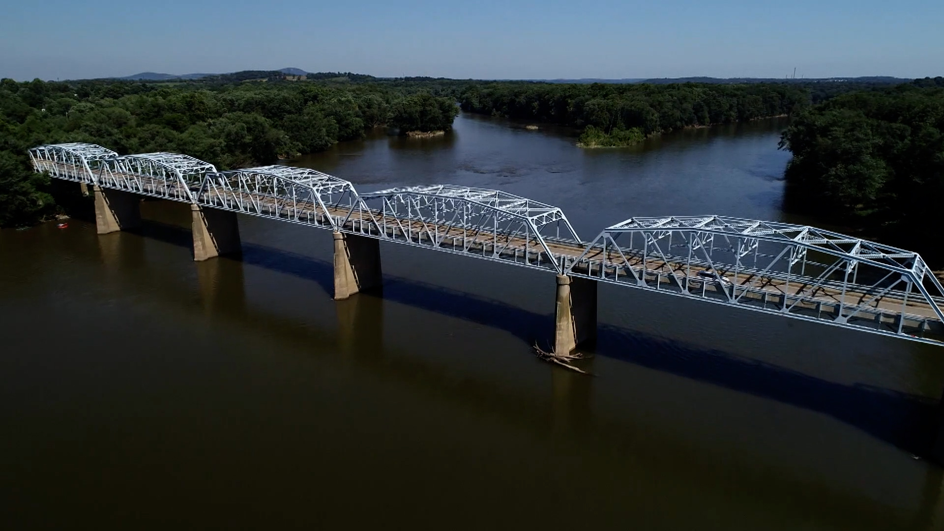 Aerial view of truss bridge over river